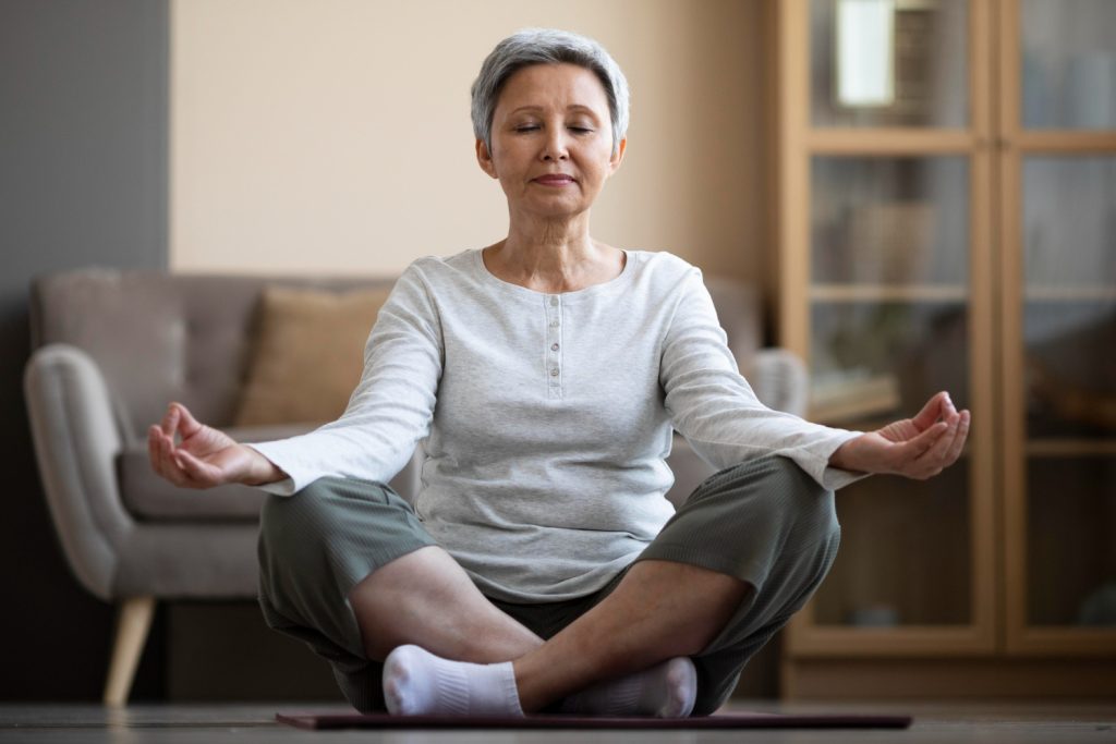 lady practicing tai chi at home for health - Tzu Chi Clinic